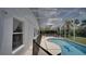 This covered pool features clear water, a dolphin design, and an abundance of lounging room at 408 Bloomingdale Dr, Davenport, FL 33897