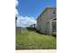 A spacious backyard with lush green grass, ideal for outdoor activities and relaxation at 464 Talisi Loop, St Cloud, FL 34771