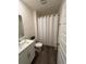 Bathroom featuring modern fixtures, patterned shower curtain, and ample lighting at 464 Talisi Loop, St Cloud, FL 34771