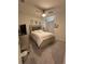 Comfortable bedroom featuring plush bedding, ceiling fan, and neutral decor at 464 Talisi Loop, St Cloud, FL 34771