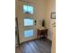 Inviting foyer with stylish flooring, elegant console table, and decorative mirror at 464 Talisi Loop, St Cloud, FL 34771