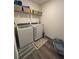 Functional laundry room with modern appliances and ample storage space at 464 Talisi Loop, St Cloud, FL 34771