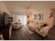 Inviting living room with modern furniture, and abundant natural light at 464 Talisi Loop, St Cloud, FL 34771