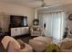 Comfortable living room with modern entertainment center and neutral color palette at 464 Talisi Loop, St Cloud, FL 34771