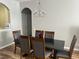 Open dining space with chandelier and seating for six at 4862 Cayview Ave # 40409, Orlando, FL 32819