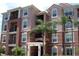 Attractive multi-story condo building with well-maintained facade and tropical landscaping at 4862 Cayview Ave # 40409, Orlando, FL 32819