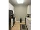 Well-equipped kitchen featuring sleek white cabinets, modern appliances, and ample counter space at 4862 Cayview Ave # 40409, Orlando, FL 32819