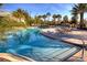 Inviting swimming pool with poolside deck, palm trees, and plenty of lounge chairs at 4862 Cayview Ave # 40409, Orlando, FL 32819