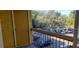 Balcony view overlooking a parking lot with lush trees and greenery at 5287 Images Cir # 307, Kissimmee, FL 34746