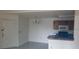 Bright open kitchen with tile floors, adjacent to the front door and dining area at 5287 Images Cir # 307, Kissimmee, FL 34746