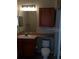 Standard bathroom design featuring sink, cabinet, mirror and toilet at 6137 Metrowest Blvd # 308, Orlando, FL 32835