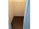 Walk-in closet with hardwood floors, white walls, and metal shelving at 6137 Metrowest Blvd # 308, Orlando, FL 32835
