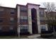 Multi-story condo building with neutral tones and well-maintained landscaping at 6137 Metrowest Blvd # 308, Orlando, FL 32835