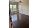 Bright living room with wood-look flooring and ample natural light at 6137 Metrowest Blvd # 308, Orlando, FL 32835