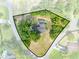 Aerial view showcasing the home, the in-ground pool, and its landscaped lot bordered by mature trees and greenery at 6441 Nightwind Cir, Orlando, FL 32818