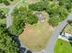 A high-angle shot of a home on a large lot surrounded by mature trees at 6441 Nightwind Cir, Orlando, FL 32818