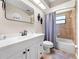 Well-lit bathroom featuring modern fixtures, a shower-tub combo, and a stylish vanity at 6441 Nightwind Cir, Orlando, FL 32818