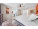 Comfortable bedroom featuring a ceiling fan and ensuite bathroom with modern wood-look flooring at 6441 Nightwind Cir, Orlando, FL 32818