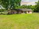 Lovely brick home with a large front lawn and mature trees, offering a serene and picturesque setting at 6441 Nightwind Cir, Orlando, FL 32818