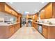Bright kitchen features light wood cabinetry, granite countertops, stainless steel appliances, and an open layout at 6441 Nightwind Cir, Orlando, FL 32818
