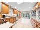 Bright kitchen with stainless steel appliances, wood cabinets, and ample counter space with an undermount sink at 6441 Nightwind Cir, Orlando, FL 32818