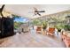 Charming screened-in patio featuring a grill, comfortable seating, and view of lush greenery at 6441 Nightwind Cir, Orlando, FL 32818