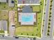 Aerial view of community pool with lounge chairs and parking at 7413 Bent Tree Loop, St Cloud, FL 34771