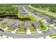 Aerial view of home in a community with pond, landscaping, and street at 7413 Bent Tree Loop, St Cloud, FL 34771
