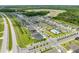 Aerial view of a residential community with well-maintained homes, landscaping, and a community pool at 7413 Bent Tree Loop, St Cloud, FL 34771
