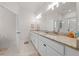 Bright bathroom with double sinks, granite countertops, and a glass-enclosed shower at 7413 Bent Tree Loop, St Cloud, FL 34771