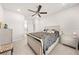 This bedroom has neutral tones, a ceiling fan, and a full bed at 7413 Bent Tree Loop, St Cloud, FL 34771
