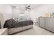 This bedroom has neutral tones, a ceiling fan, and a full bed at 7413 Bent Tree Loop, St Cloud, FL 34771
