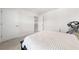 Bright bedroom features a black bed, side table, and inversion table at 7413 Bent Tree Loop, St Cloud, FL 34771