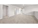 Neutral bonus room featuring plush carpet and multiple doorways, perfect for entertaining at 7413 Bent Tree Loop, St Cloud, FL 34771