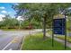 Community entrance sign with directions to amenities in a manicured landscape at 7413 Bent Tree Loop, St Cloud, FL 34771