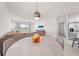 Open-concept dining area and living room with modern furnishings and natural light at 7413 Bent Tree Loop, St Cloud, FL 34771