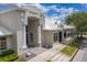 Exterior of a community building featuring grand pillars and architectural details at 7413 Bent Tree Loop, St Cloud, FL 34771