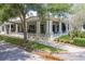 Exterior of a community building with a covered patio and lush landscaping at 7413 Bent Tree Loop, St Cloud, FL 34771