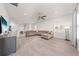 Open living room features wood flooring, modern decor, and abundant natural light at 7413 Bent Tree Loop, St Cloud, FL 34771