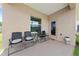 Covered patio with seating area, perfect for outdoor dining and relaxation at 7413 Bent Tree Loop, St Cloud, FL 34771