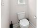 Half bath featuring a toilet, tile floor and small window providing natural light at 7413 Bent Tree Loop, St Cloud, FL 34771