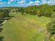 Expansive community recreation field with soccer goals, picnic benches and winding trails surrounded by mature trees at 7413 Bent Tree Loop, St Cloud, FL 34771
