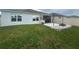 Lawn featuring a backyard patio with pergola and fire pit, offering an ideal space for outdoor entertaining and relaxation at 820 Cambridge Dr, Winter Haven, FL 33881