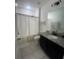 Clean bathroom featuring a shower, toilet, and vanity with granite countertop, creating a functional space at 820 Cambridge Dr, Winter Haven, FL 33881