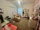 Cozy bedroom with a chair, desk and closet, decorated with stylish décor and accessories at 820 Cambridge Dr, Winter Haven, FL 33881