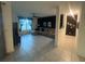 Spacious living room with a comfortable sectional sofa, large window, and modern decor creating a relaxing atmosphere at 820 Cambridge Dr, Winter Haven, FL 33881