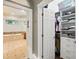 Bathroom with a walk-in closet view, marble floors, and soaking tub at 8214 Lake Serene Dr, Orlando, FL 32836