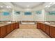 The bathroom has dual sinks, granite countertops, and a large tub at 8214 Lake Serene Dr, Orlando, FL 32836
