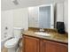 Bathroom featuring a vanity with granite countertop and neutral wall color at 8214 Lake Serene Dr, Orlando, FL 32836