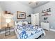 Bright bedroom featuring a stylish blue and white quilt and decorative shelves at 8214 Lake Serene Dr, Orlando, FL 32836
